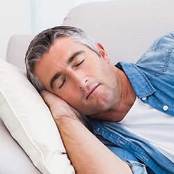 Man sleeping on couch